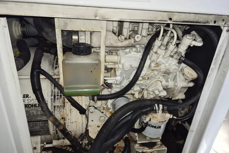 Slide: The Image of Engine compartment of a 2013 Azimut 36 yacht, featuring Kohler components and hoses. - 21