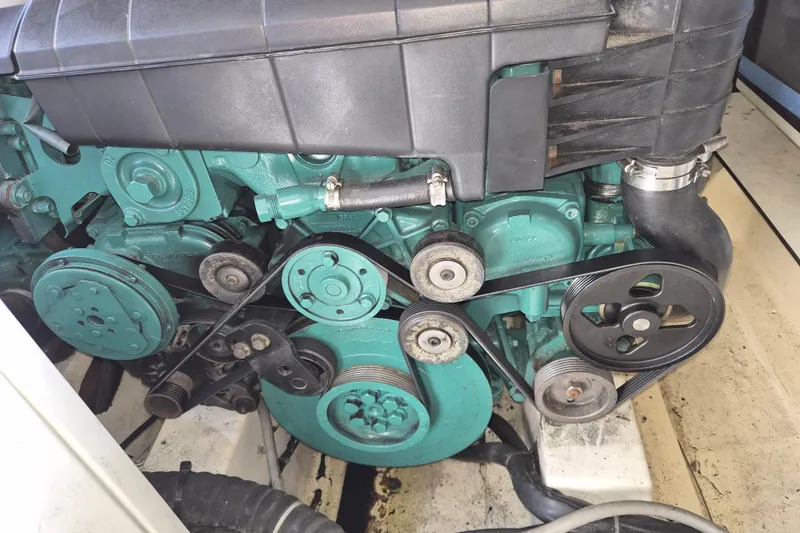 Slide: The Image of Engine of a 2013 Azimut 36 yacht, showcasing belts and components. - 23