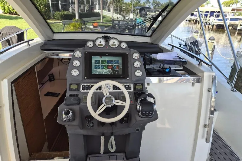 Slide: The Image of Cockpit of 2013 Azimut 36 yacht with modern navigation controls and steering wheel. - 8