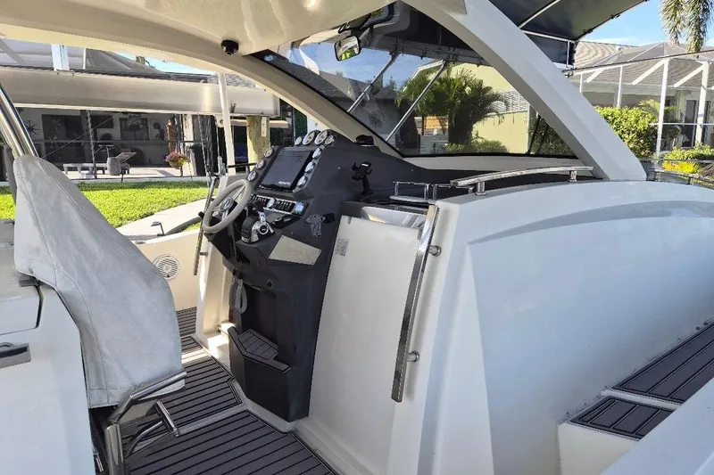 Slide: The Image of 2013 Azimut 36 yacht cockpit with modern steering and control panel. - 9