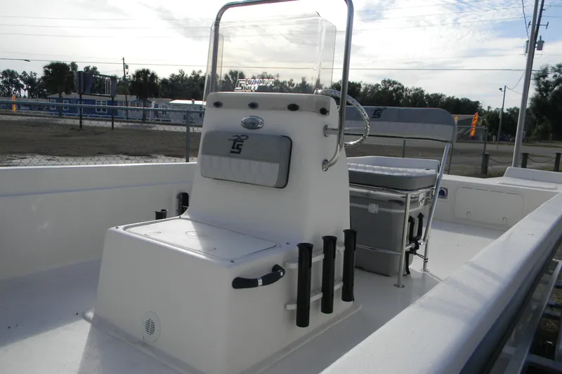 Slide: The Image of 2026 Carolina Skiff E24 DLX CC boat interior with console and seating. - 5