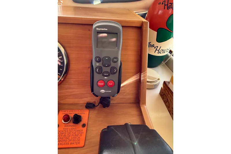 Slide: The Image of 2006 Mainship 34 Trawler interior with access hatch and control panel. - 29