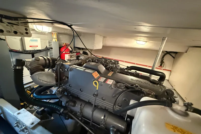 Slide: The Image of Engine room of a 2006 Mainship 34 Trawler, showcasing detailed mechanical components. - 34