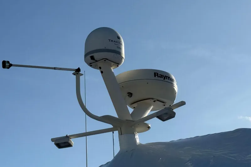 Slide: The Image of 2006 Mainship 34 Trawler deck view at marina with surrounding boats. - 5