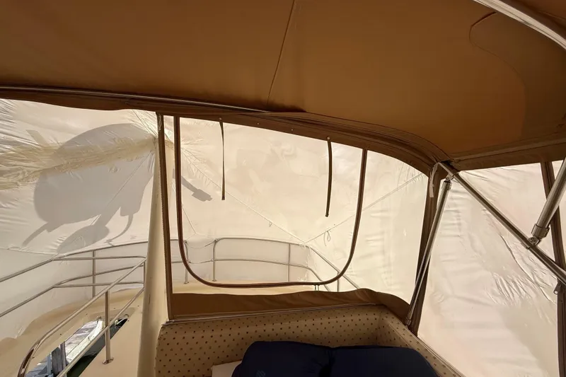 Slide: The Image of Radar and satellite equipment on 2006 Mainship 34 Trawler against clear blue sky. - 7