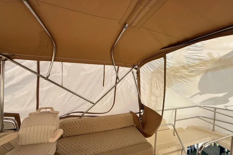 Slide: The Image of Interior of 2006 Mainship 34 Trawler with helm, seating, and navigation equipment. - 8