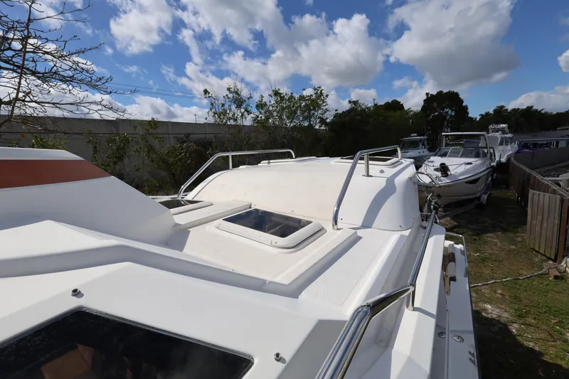 Slide: The Image of 2015 Ranger Tugs R-29 S boat deck under a partly cloudy sky. - 34