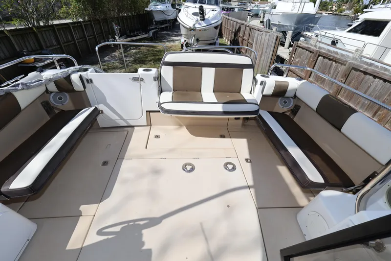 Slide: The Image of 2015 Ranger Tugs R-29 S boat interior with spacious seating and modern design. - 35