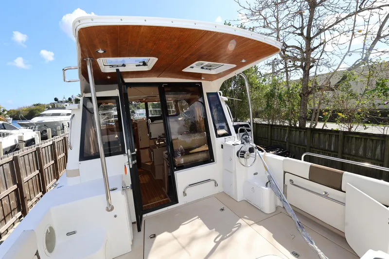 Slide: The Image of 2015 Ranger Tugs R-29 S boat with spacious deck and wooden ceiling. - 9