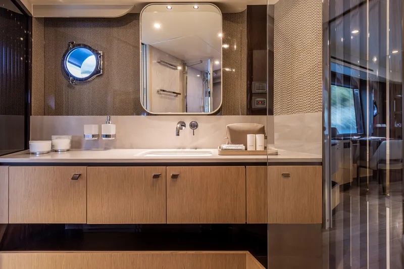 Slide: The Image of Luxurious bathroom on 2025 Absolute 56 FLY yacht with modern fixtures and elegant design. - 23