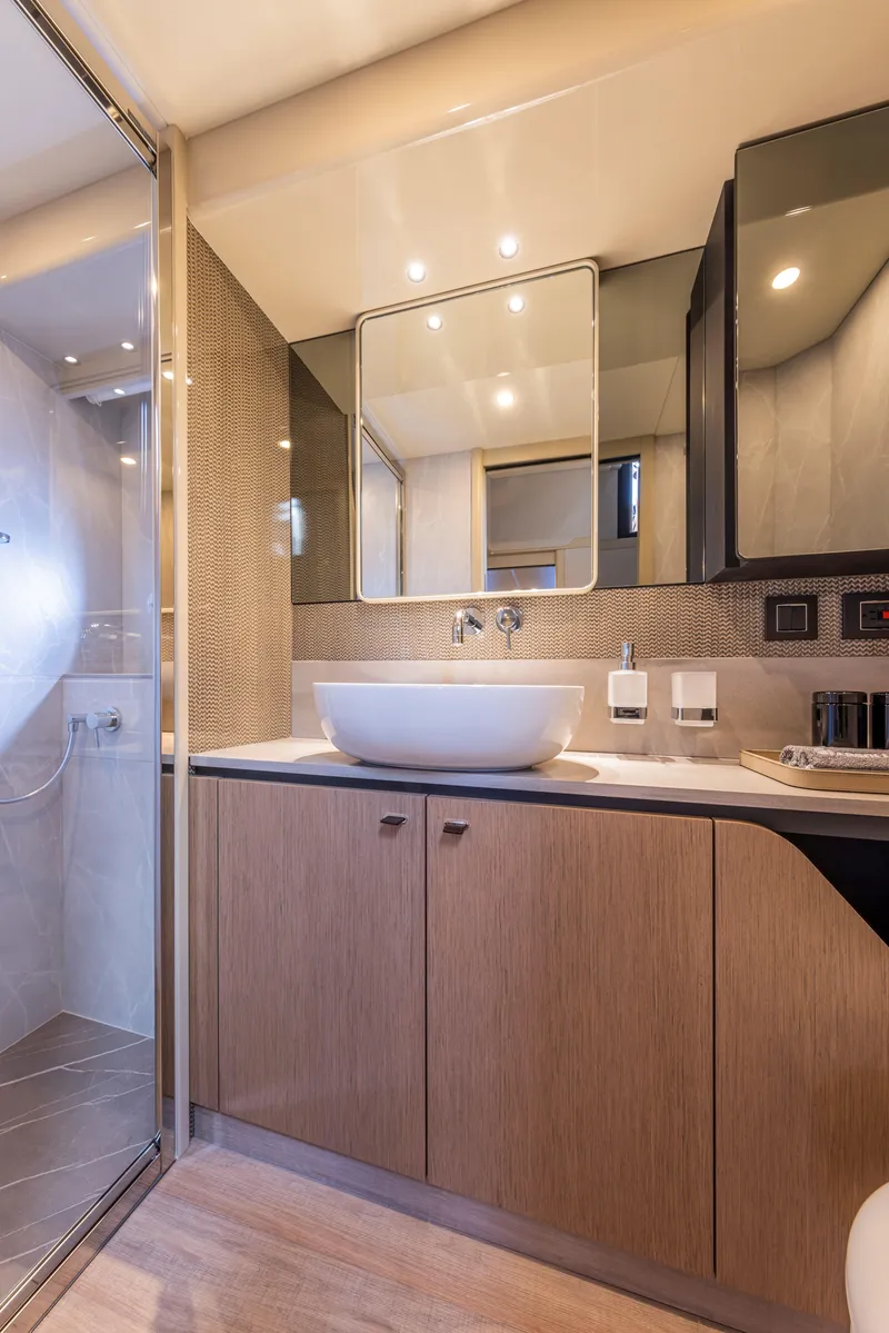 Slide: The Image of Luxurious bathroom in 2025 Absolute 56 FLY yacht with modern fixtures and elegant design. - 26