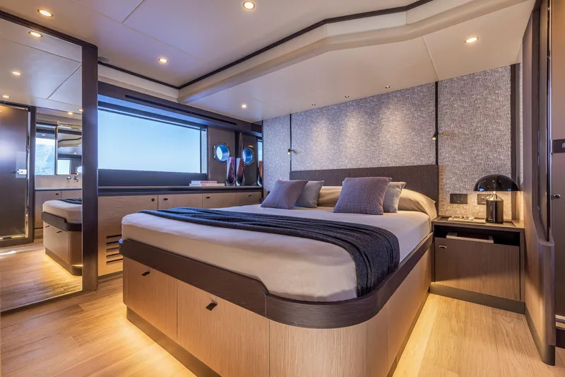 Slide: The Image of Luxurious bedroom interior of 2025 Absolute 56 FLY yacht, featuring modern design and ambient lighting. - 27