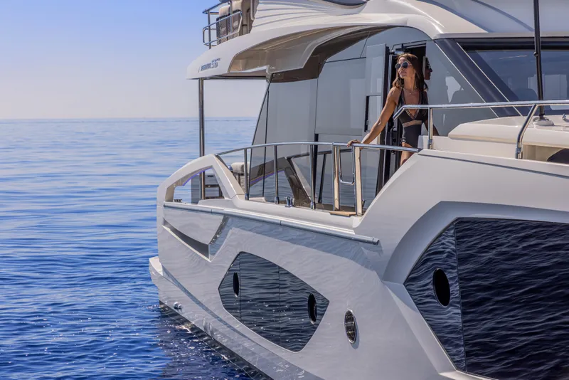 Slide: The Image of Luxury Absolute 56 FLY yacht cruising on serene blue waters, 2025 model. - 5