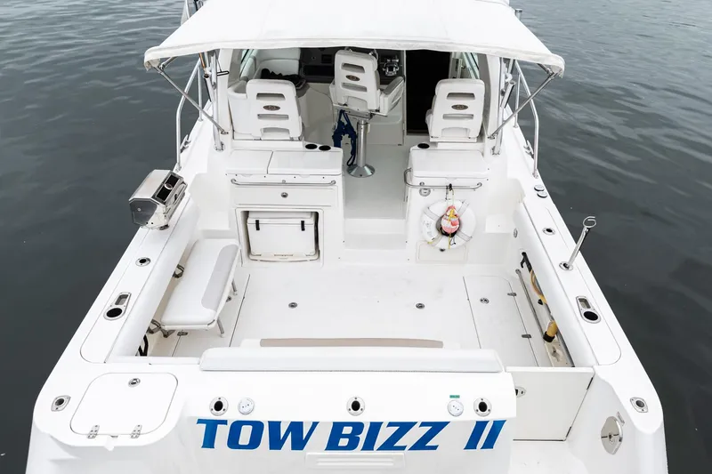 Slide: The Image of 2008 Boston Whaler 345 Conquest boat, rear view, with seating and equipment, named "Tow Bizz II". - 20