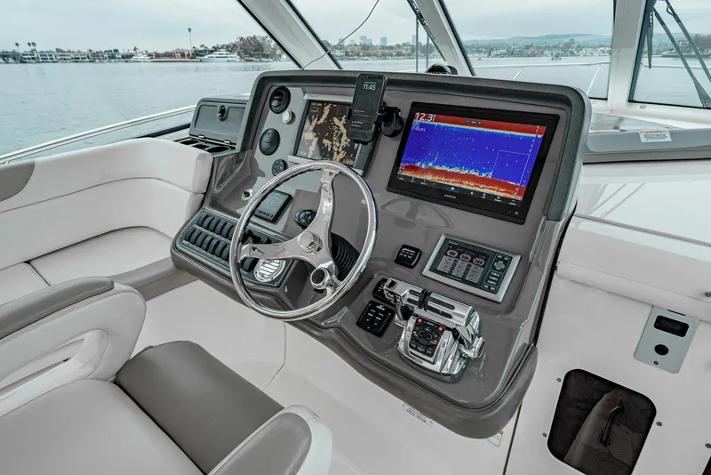Slide: The Image of 2008 Boston Whaler 345 Conquest helm with advanced navigation and control systems. - 36