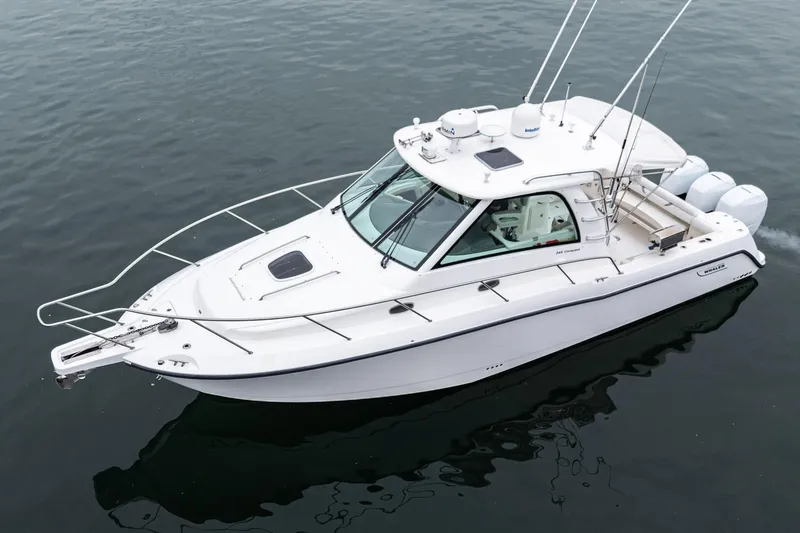 Slide: The Image of 2008 Boston Whaler 345 Conquest boat on calm water, side view. - 4