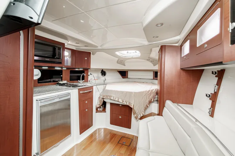 Slide: The Image of Luxurious interior of 2008 Boston Whaler 345 Conquest with kitchenette and bed. - 44
