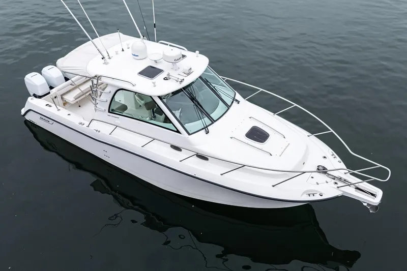 Slide: The Image of 2008 Boston Whaler 345 Conquest boat on calm water, aerial view. - 5