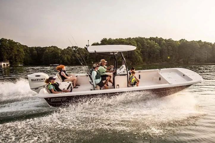 The Image of Manufacturer Provided Image: 2026 Carolina Skiff 25 LS boat cruising on a lake with passengers enjoying the ride. - 0