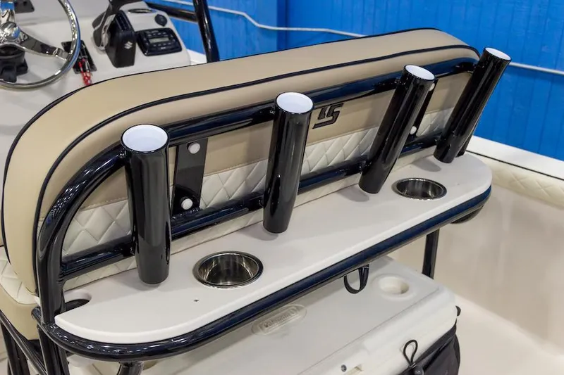 Slide: The Image of Manufacturer Provided Image: 2026 Carolina Skiff 25 LS boat interior with rod holders and cup holders. - 11