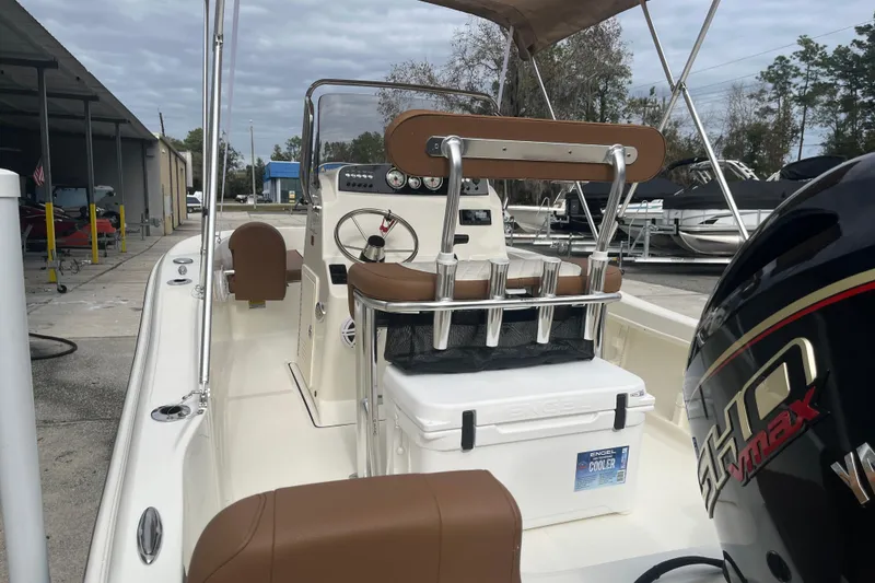 Slide: The Image of 2026 Pioneer 180 Sportfish boat with Yamaha Vmax engine, featuring a center console and cooler. - 19