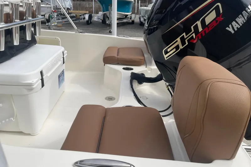 Slide: The Image of 2026 Pioneer 180 Sportfish boat interior with Yamaha engine and seating. - 20