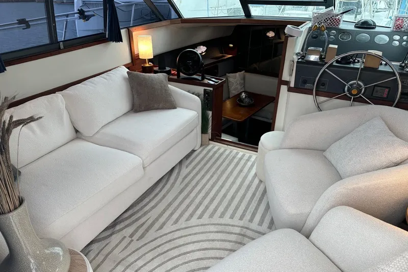 Slide: The Image of Luxurious interior of 1989 Tiara Yachts 3100 Flybridge with plush seating and elegant decor. - 1