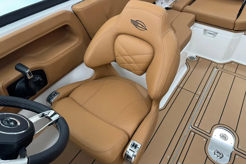 Slide: The Image of Luxurious tan interior of 2026 Chaparral 250 OSX boat with ergonomic seating. - 18