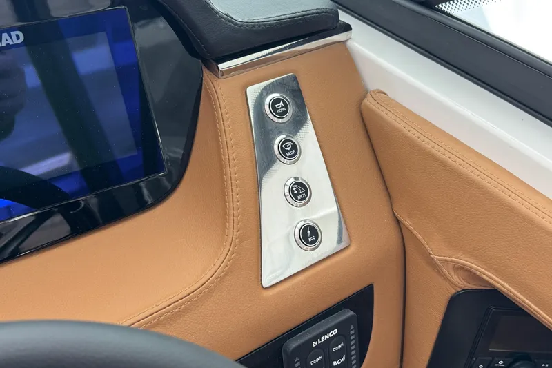 Slide: The Image of Control panel of 2026 Chaparral 250 OSX boat with leather trim and touchscreen display. - 25
