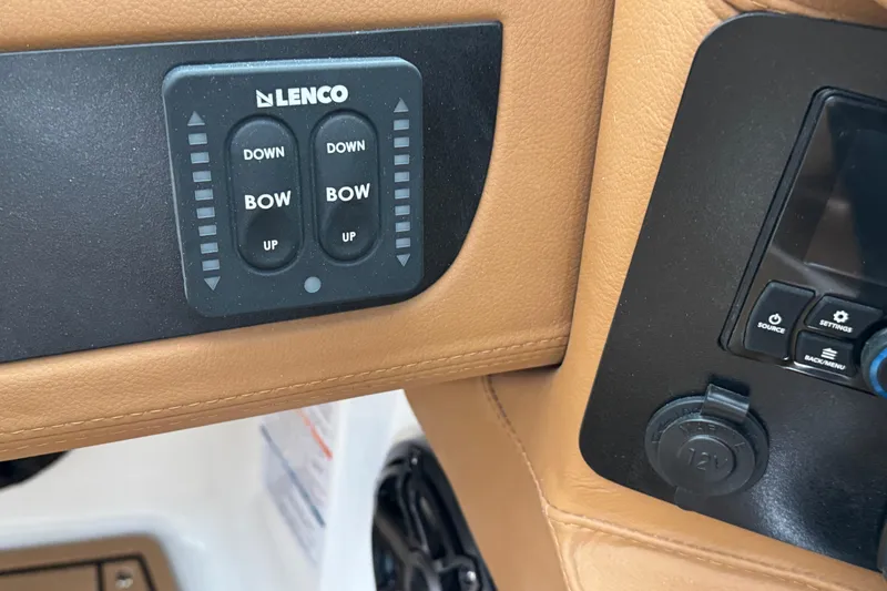 Slide: The Image of Control panel of 2026 Chaparral 250 OSX boat with Lenco trim tab switches. - 27