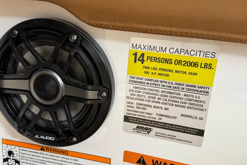 Slide: The Image of Chaparral 250 OSX 2026 boat capacity label, 14 persons or 2006 lbs, with speaker. - 29