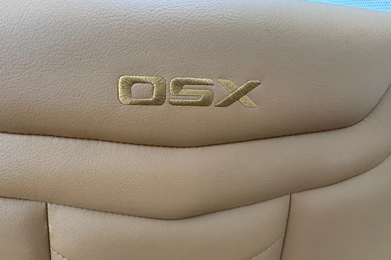 Slide: The Image of Beige leather seat with "OSX" embroidery, Chaparral 250 OSX 2026 model. - 34