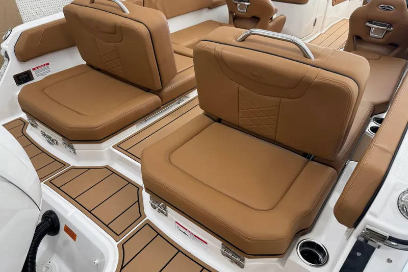Slide: The Image of 2026 Chaparral 250 OSX boat interior with luxurious tan seating and modern design. - 5