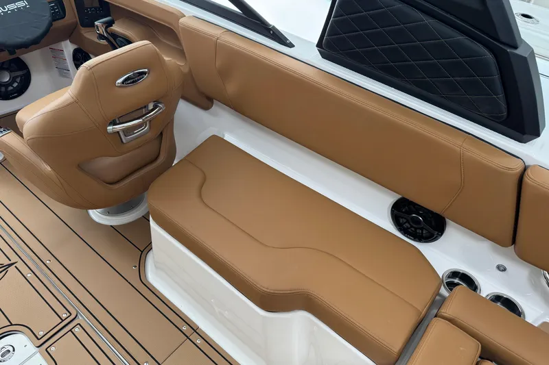 Slide: The Image of 2026 Chaparral 250 OSX boat interior with tan leather seating and modern design. - 6