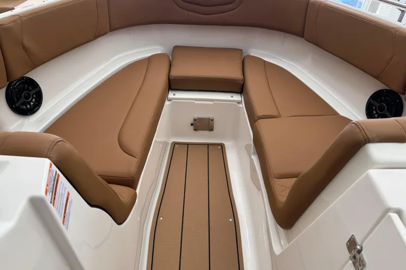 Slide: The Image of 2026 Chaparral 250 OSX boat interior with tan leather seating and sleek design. - 9