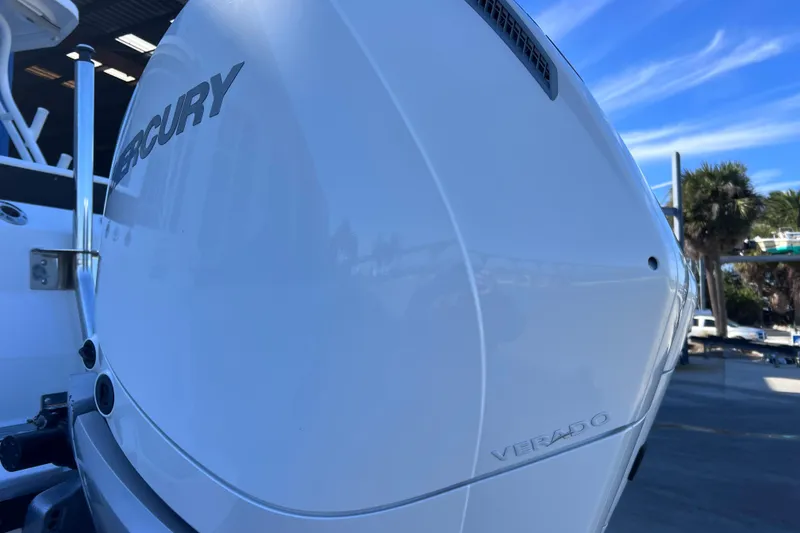 Slide: The Image of Close-up of a 2022 Blackfin 272 DC boat's Mercury Verado engine outdoors. - 30