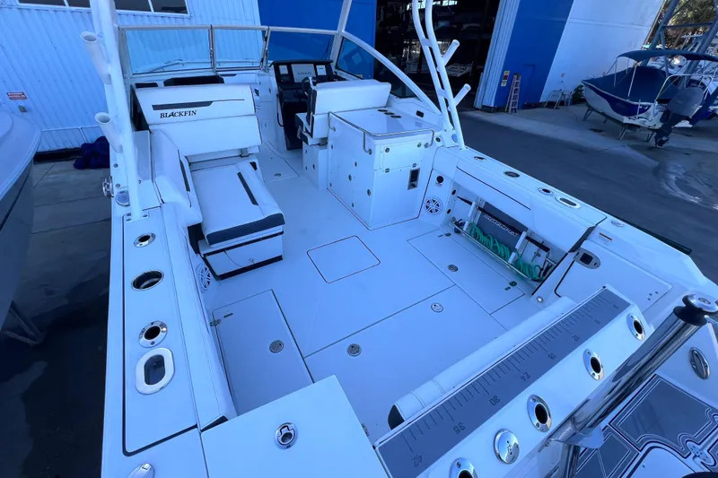 Slide: The Image of 2022 Blackfin 272 DC boat interior with seating and storage compartments. - 33