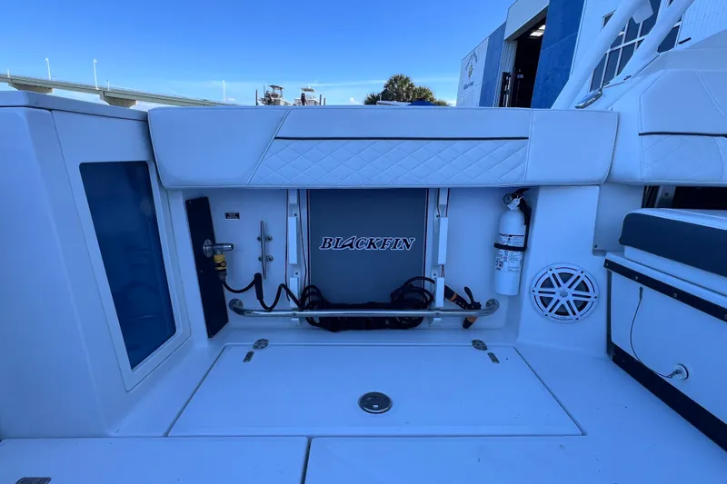 Slide: The Image of 2022 Blackfin 272 DC boat interior with storage and safety equipment. - 37
