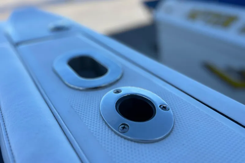 Slide: The Image of Close-up of 2022 Blackfin 272 DC boat's rod holder and deck details. - 42