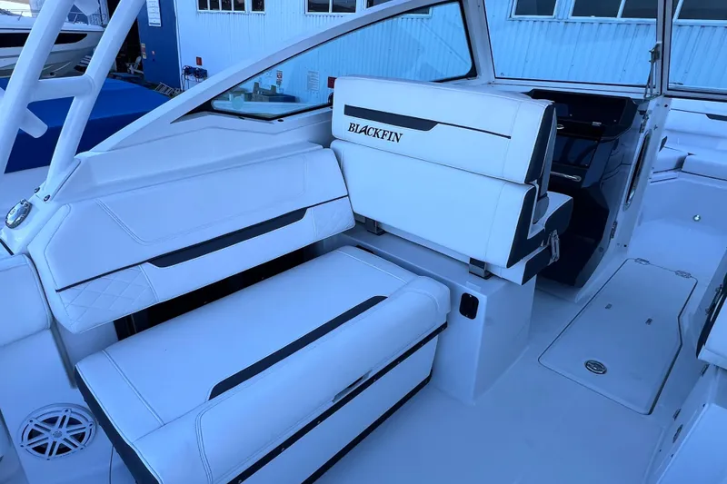 Slide: The Image of 2022 Blackfin 272 DC boat interior with white seating and sleek design. - 43