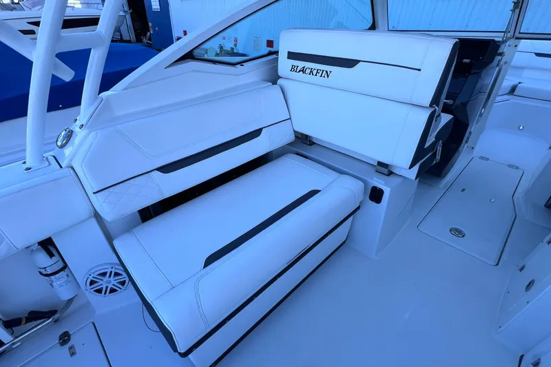 Slide: The Image of 2022 Blackfin 272 DC boat interior with white seating and modern design. - 45