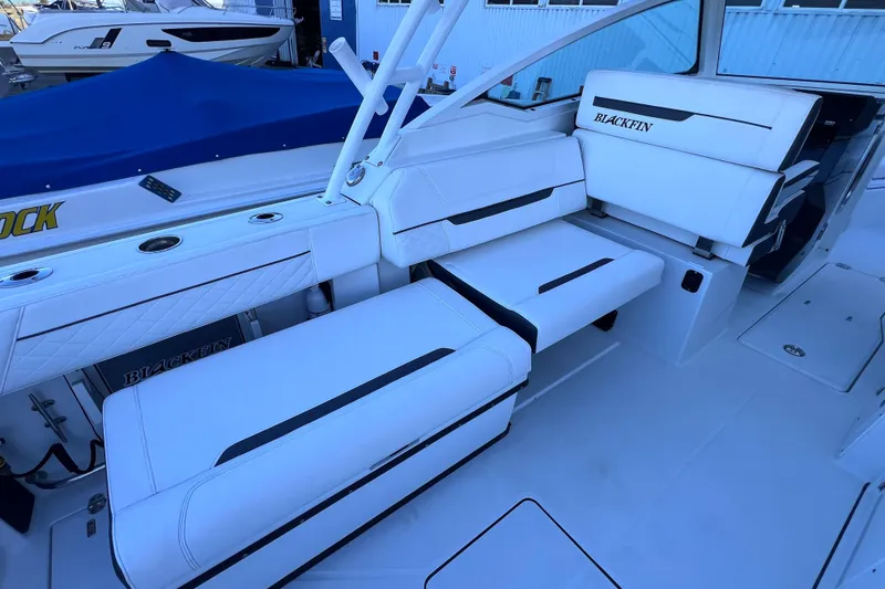 Slide: The Image of 2022 Blackfin 272 DC boat interior with white seating and sleek design. - 47
