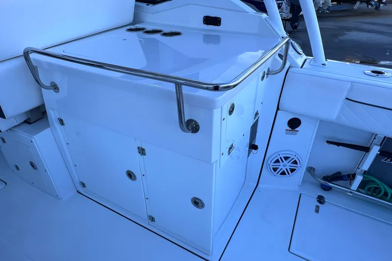 Slide: The Image of 2022 Blackfin 272 DC boat interior with storage compartments and stainless steel railing. - 50