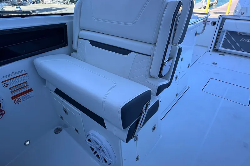 Slide: The Image of 2022 Blackfin 272 DC boat interior with white seating and modern design. - 57