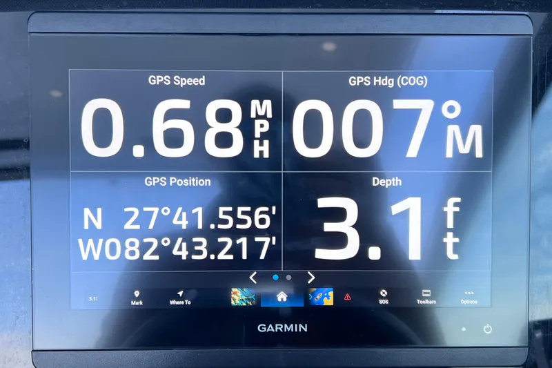 Slide: The Image of Garmin GPS display on 2022 Blackfin 272 DC showing speed, heading, position, and depth. - 66