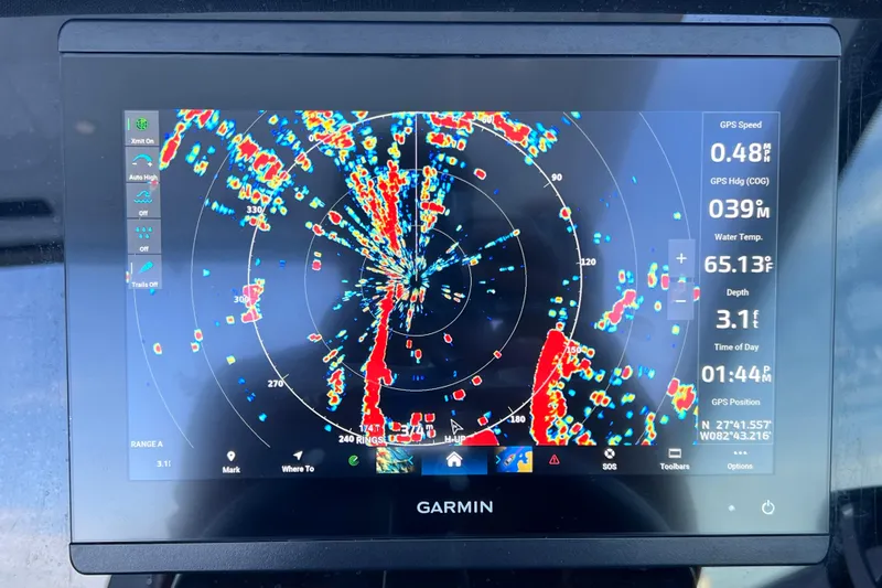 Slide: The Image of Garmin marine radar display on 2022 Blackfin 272 DC boat, showing navigation data. - 68