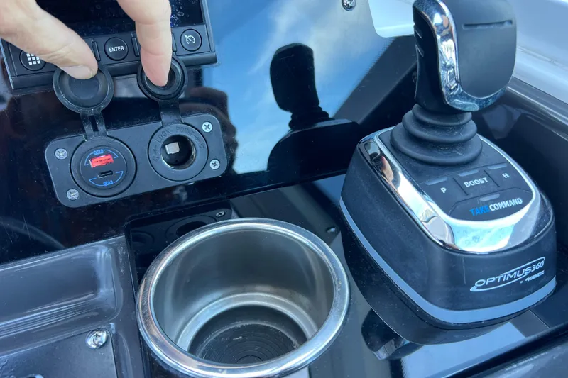 Slide: The Image of Control panel of 2022 Blackfin 272 DC boat with joystick and cup holder. - 73