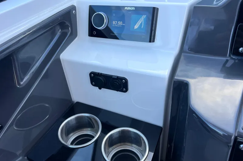 Slide: The Image of 2022 Blackfin 272 DC boat console with Fusion stereo and dual cup holders. - 78
