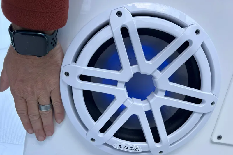 Slide: The Image of Hand near JL Audio speaker on 2022 Blackfin 272 DC boat. - 79