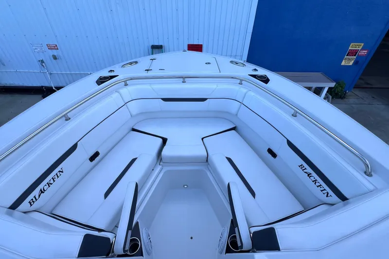 Slide: The Image of 2022 Blackfin 272 DC boat interior with white seating and branding. - 84